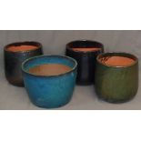 GARDEN STONEWARE - a trio of glazed pots, 35cms tall and 33cms diameter at top, and another