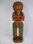 TREEN - wooden carved and painted figure of a Native Indian in war dress, 64cms tall