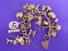 9CT GOLD LINK CHAIN (all marked) with padlock and approximately 18 good charms, 90grms gross