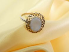 14CT GOLD OPAL SET RING - the mounted stone with lattice work surround, size mid T - U, 4.1grms