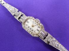 A LADY'S OBLONG DIAL MARCASITE 9CT WHITE GOLD WRISTWATCH - with believed 9ct white gold strap having