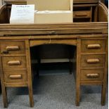 CIRCA 1900 OAK ROLL TOP DESK and a boxed ceiling fan, the desk tambour requiring restoration, 107cms