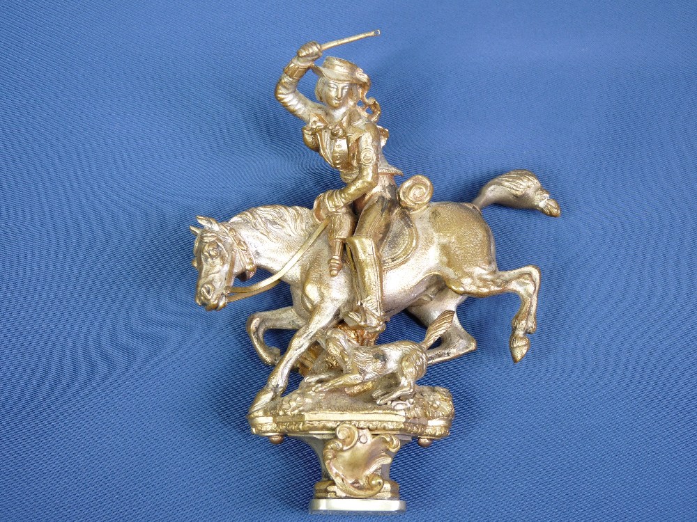 A GILT BRONZE 'BARON HILL' BEAUMARIS SEAL in the form of a horse and rider leading her dog, 10.