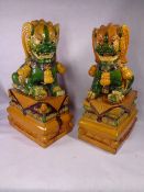 CONTEMPORARY CHINESE POTTERY MAJOLICA STYLE TEMPLE LIONS ON RECTANGULAR BASES - 64cms overall H,