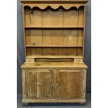 VINTAGE STRIPPED PINE KITCHEN DRESSER - a shaped upper frieze over three shelves and wide back