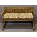 PRIORY STYLE OAK HALL BENCH - with linenfold carved panels to the back and open arms on turned and