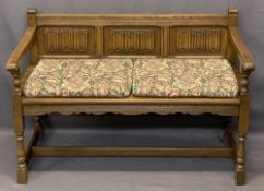 PRIORY STYLE OAK HALL BENCH - with linenfold carved panels to the back and open arms on turned and