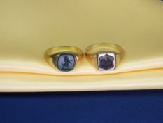 TWO UNMARKED GENT'S GOLD SIGNET RINGS - one with a cockerel seal and the other with a rampant lion