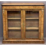 CIRCA 1850 INLAID WALNUT TWO DOOR SIDE CABINET - with brass embellishments on a plinth base, 99cms