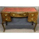 WALNUT WRITING TABLE - mid-century with red leather gilt tooled skiver, central bowed drawer and