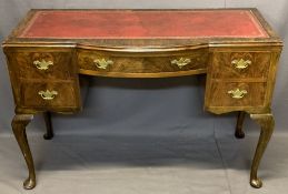 WALNUT WRITING TABLE - mid-century with red leather gilt tooled skiver, central bowed drawer and