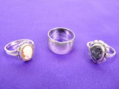 A 1973 WIDE SILVER SIGNET RING - 7.2grms, and two lady's silver dress rings, 6.3grms