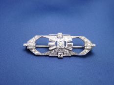 LADY'S OBLONG PLATINUM & DIAMOND BROOCH, 4cms long, 1cms W, having a centre round cut diamond,