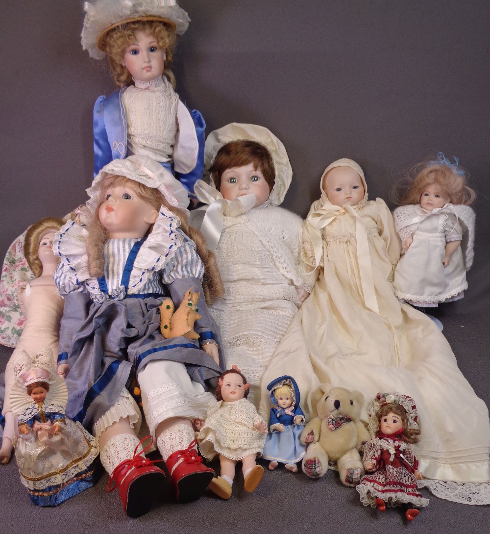 PORCELAIN HEADED DOLLS, an assortment of 20th Century, some with stands