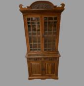 EARLY 20th CENTURY BOOKCASE CUPBOARD with two middle section drawers, adjustable shelves to the