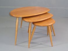 ERCOL 'PEBBLE' TABLES, nest of three, light coloured