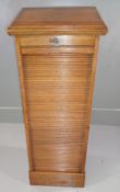 TAMBOUR FRONTED FILING CABINET, early 20th Century in oak with ten tray inserts, 118cms H, 49cms