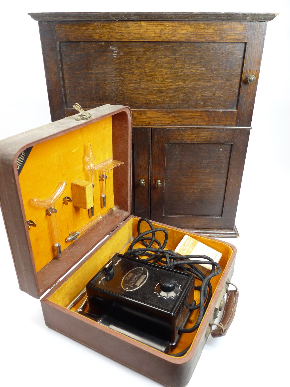 OAK MEDICINE TYPE CABINET and a cased Bakelite medical item by Juventus, 51cms H, 46.5cms W, 26cms D