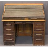 VINTAGE OAK ROLL TOP DESK - the tambour front opening to reveal interior drawers and pigeonholes