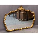 ROCOCO STYLE GILT FRAMED OVERMANTEL MIRROR - the shaped frame with shell type crest, 90cms H, 122cms