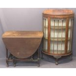 WALNUT CHINA DISPLAY CABINET and an oak gateleg dining table, the cabinet half-moon with central