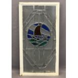 METAL FRAMED LEADED GLASS WINDOW PANEL - central circular coloured depiction of a yacht, 90.5cms