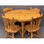 MODERN CIRCULAR TOP PINE TABLE & FOUR FARMHOUSE CHAIRS with turned spindle backs, 77cms H, 109cms