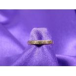 A LADY'S 9CT GOLD ETERNITY RING - with tiny diamond chippings, 1.8grms gross