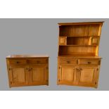MODERN PINE DRESSER - the base with fielded panels and two drawers over two doors, with a two