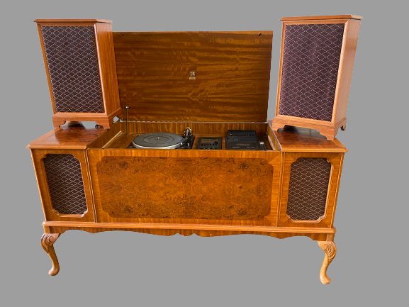 DYNATRON RADIOGRAM with a pair of floor standing speakers, in a walnut effect cabinet, 75cms H,