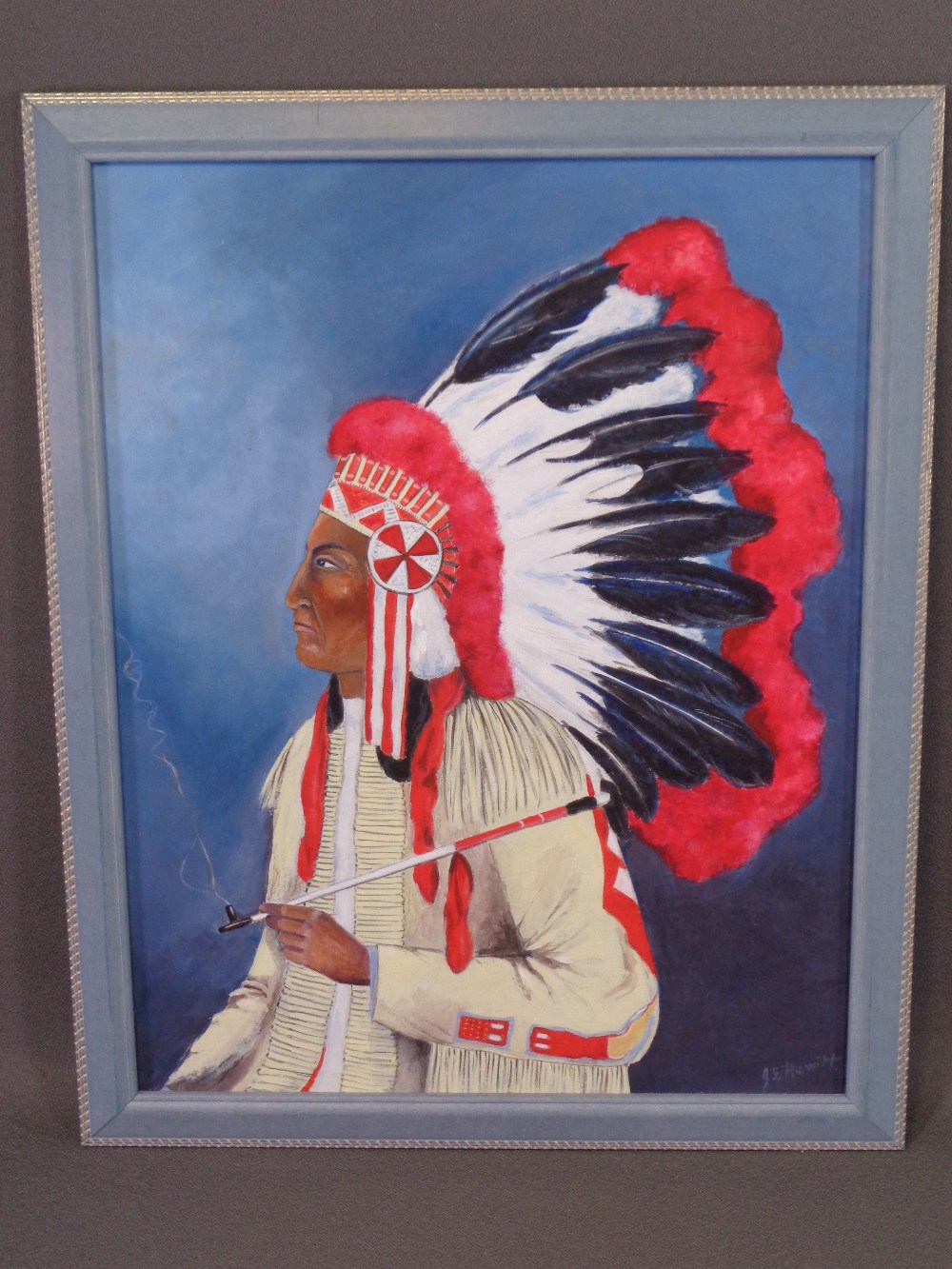 J E HEWITT oil on board - portrait of a Native American Indian with head-dress, signed right hand