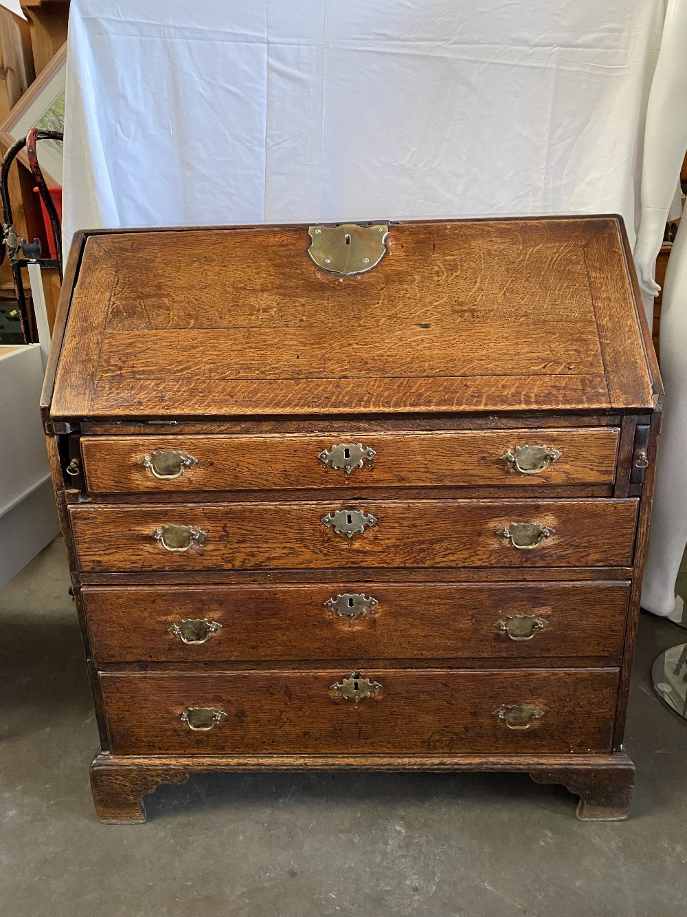 BUREAU - Georgian oak having a sloped front with large brass lock plate revealing a centre open - Image 2 of 5