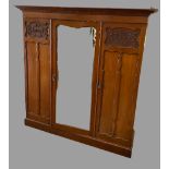 TRIPLE WARDROBE - Edwardian mahogany with shaped mirrored central door, with sliders to the right