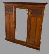 TRIPLE WARDROBE - Edwardian mahogany with shaped mirrored central door, with sliders to the right