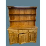 FARMHOUSE PINE STYLE DRESSER having a two shelf rack over a three drawer and three door base, 177cms