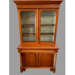 ANTIQUE MAHOGANY BOOKCASE CUPBOARD or 'Cwpwrdd Gwydr', having a base section with turned pillars and