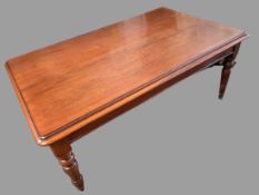 VICTORIAN DINING TABLE - oblong topped with turned corner supports on castors, 180 x 110cms