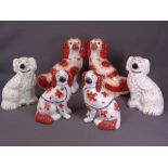 STAFFORDSHIRE COMFORTER DOGS, three pairs - smaller red and white pair with separate front legs,