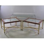 ORNATE COFFEE TABLES - a pair, wood and glass topped with brass effect and crinoline stretcher