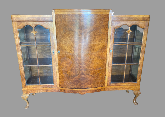 BURR WALNUT BOOKCASE - Queen Anne style with two glazed doors either side of a bow front, on