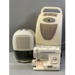 AMCOR TROLLEY DEHUMIDIFIER, a Delonghi portable dehumidifier and a modern electric sewing machine