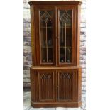 REPRODUCTION GOTHIC-STYLE STAINED OAK STANDING CORNER CABINET, with tracery doors, and carved