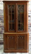 REPRODUCTION GOTHIC-STYLE STAINED OAK STANDING CORNER CABINET, with tracery doors, and carved