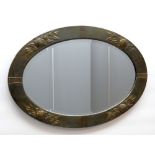 ARTS & CRAFTS-STYLE METAL FRAMED OVAL WALL MIRROR, embossed fruit and leaves to the sides, bevel