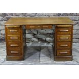 1930s OAK PEDESTAL DESK, fitted with slides and drawers to each plinth, panelled sides and front,