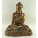 BURMESE LACQUERED WOOD BUDDHA SHAKYAMUNI, seated in flowing robes ornamented with coloured mirror