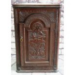 CARVED OAK & INLAID HANGING CORNER CUPBOARD, with breakarch door decorated with putto holding a