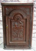 CARVED OAK & INLAID HANGING CORNER CUPBOARD, with breakarch door decorated with putto holding a