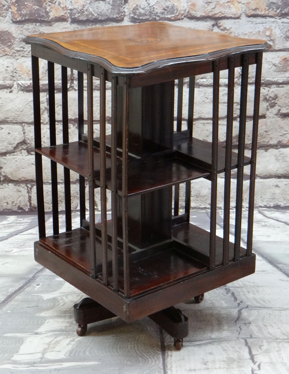 EDWARDIAN MAHOGANY & MARQUETRY REVOLVING BOOKCASE with shaped inlaid top, 50cms wide
