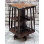 EDWARDIAN MAHOGANY & MARQUETRY REVOLVING BOOKCASE with shaped inlaid top, 50cms wide